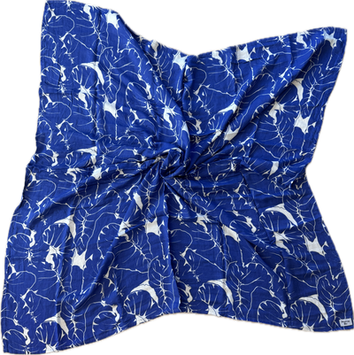 Blue fabric with white patterns on a white background