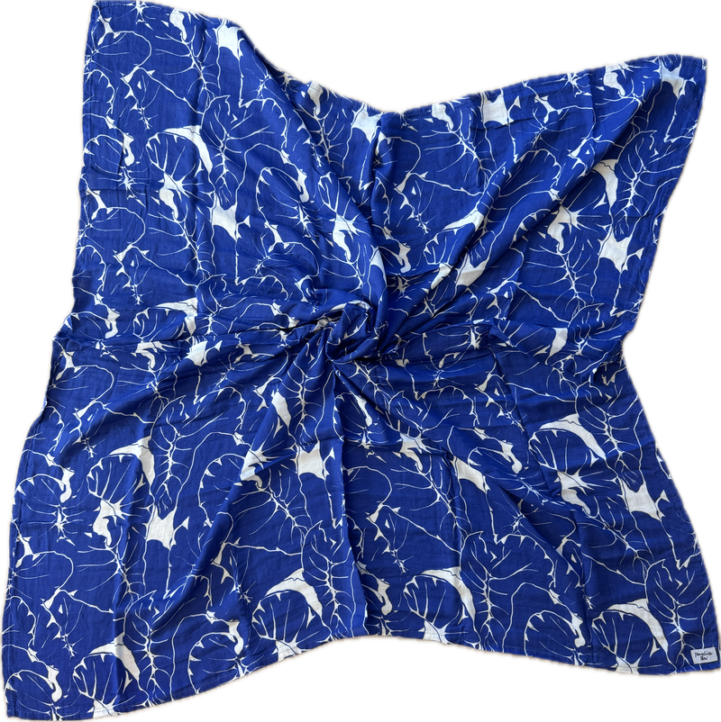 Blue fabric with white patterns on a white background