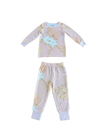 Children's pajama set with floral pattern on a pink background
