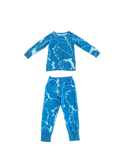 Blue children's pajama set with a blue leaf pattern on a blue background