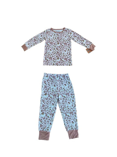 Floral-patterned pajama set on a brown background