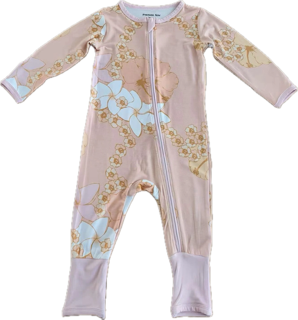 Baby onesie with floral pattern on a pink background