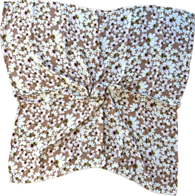 Floral headscarf with white flowers on a brown background
