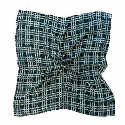 Green and white checkered fabric on a green background