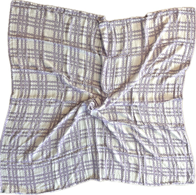 Plaid patterned fabric swatch on a yellow background