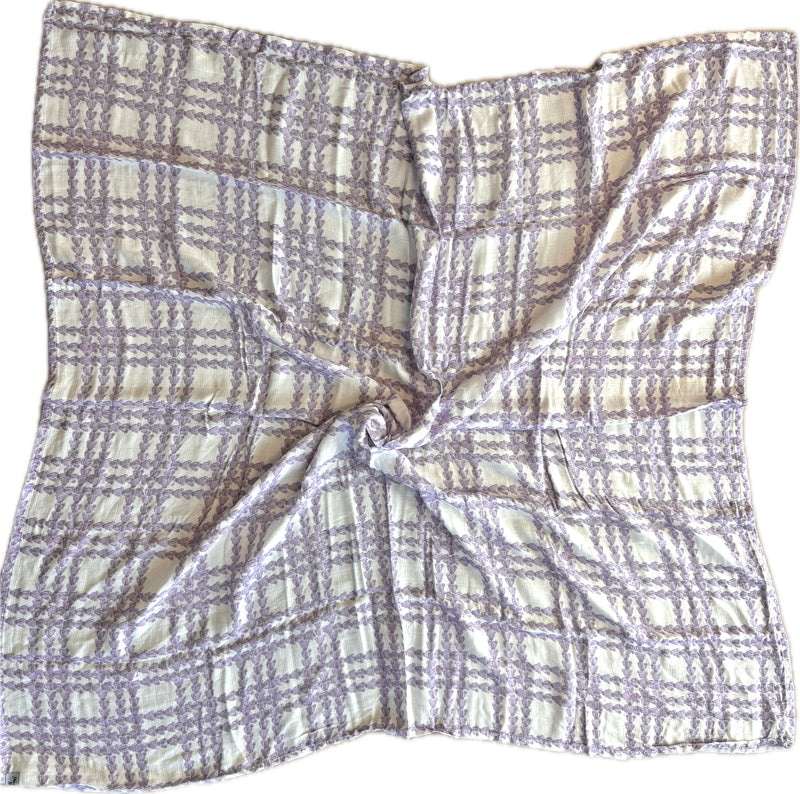 Plaid patterned fabric swatch on a yellow background