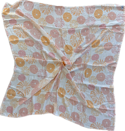 Floral patterned fabric with pink and orange flowers on a white background